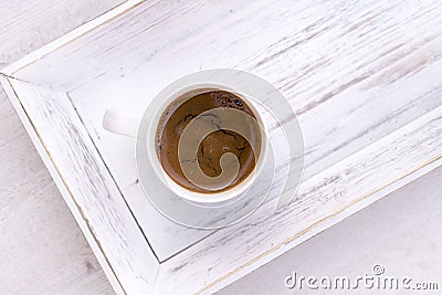 Cup of coffee on white wooden salver Stock Photo