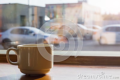 Cup of coffee by the window Stock Photo