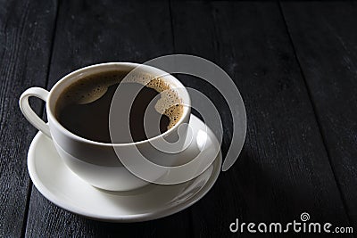 Cup of coffee on wooden table Stock Photo