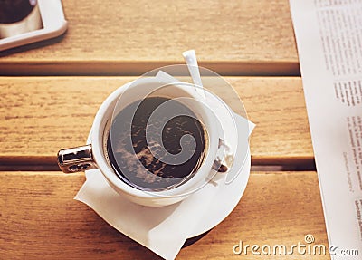 A cup of coffee on the wooden table Stock Photo