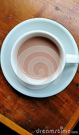 A cup of coffee on a wooden table. 11.4.2023 Kalijati district, Subang district, West Java Stock Photo