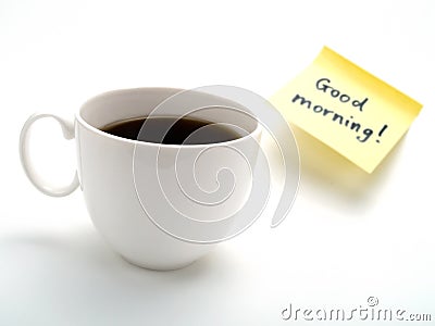 A cup of coffee and a yellow note Stock Photo