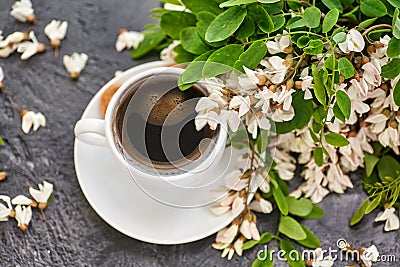 Cup of coffeel and acacia closeup Stock Photo