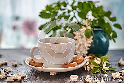 Cup of coffeel and acacia closeup. Stock Photo