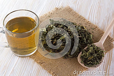 Cup and dried herbal tea. Stock Photo