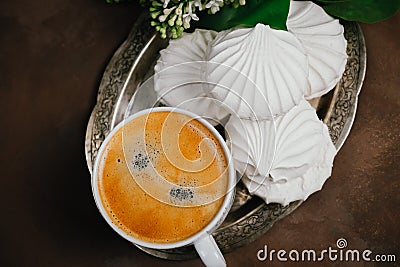Cup of espresso and sweet dessert on silver platter. Coffee time. Coffee shop concept. Stock Photo