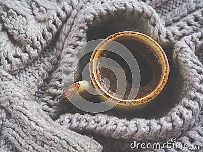 A Cup of espresso in a winter sweater. The concept of home comfort, coziness and warmth. Stock Photo