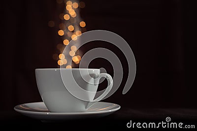 Cup with fantasy golden bokeh steam Stock Photo