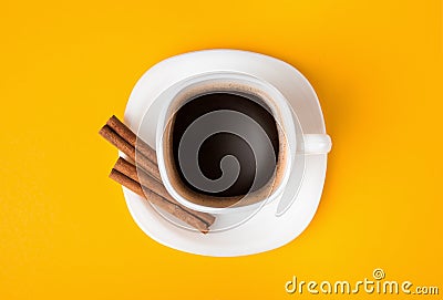 Cup of fresh espresso on yellow background, view from above Stock Photo
