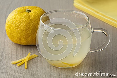 Cup with fresh Japanese Yuzu tea Stock Photo