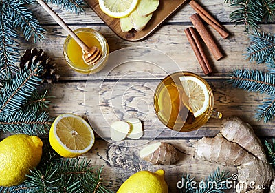 Cup of ginger tea with honey and lemon on wooden table. Healthy drink. Hot winter Christmas beverage concept. Stock Photo