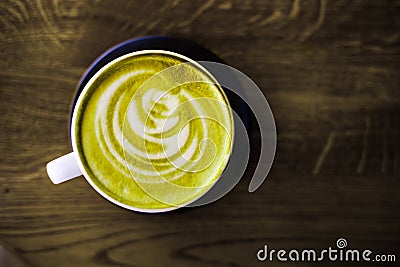 A cup of green tea matcha latte. Stock Photo