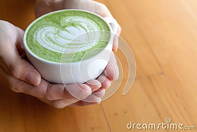 A cup of green tea matcha latte Stock Photo