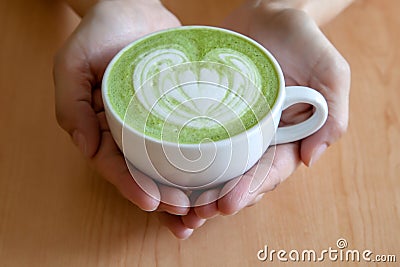 A cup of green tea matcha latte Stock Photo