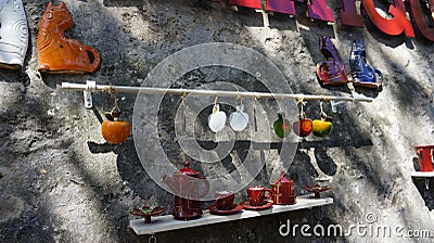Cup Hanging on the stone wall Stock Photo
