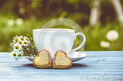 Cup of herbal tea and cookies hearts. Romantic concept Stock Photo
