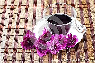 Cup of herbal tea of mauve flowers fresh Stock Photo