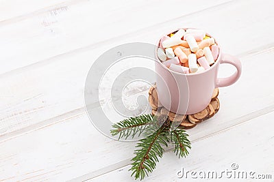 A cup of hot chocolate coffee, cocoa with marshmallows inside of it on a white wooden background planks Stock Photo