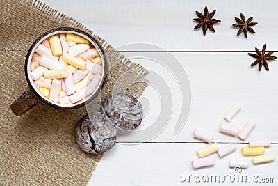 Cup of hot cocoa with marshmallows and cookies on white table, top view, copy space Stock Photo