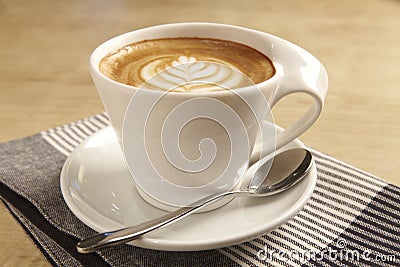 Cup of hot latte art coffee Stock Photo