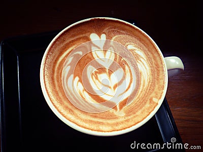 Cup of hot latte or cappuccino with fascinating latte art Stock Photo