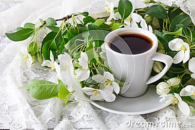 Cup of hot tasty coffee in very spring floral setting. Full of white and very cute pink color. Romantic decor elements Stock Photo