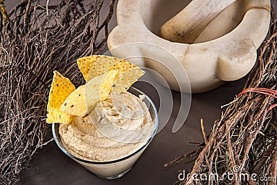 Cup with hummus appetizer, nachos and traditional decoration Stock Photo