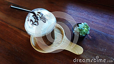A cup of ice coffee with cactus Stock Photo