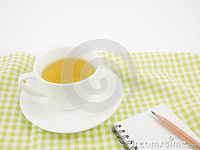 The cup of Japanese green tea and small note book Stock Photo