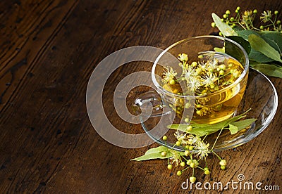 cup of linden tea on an old wooden table Stock Photo