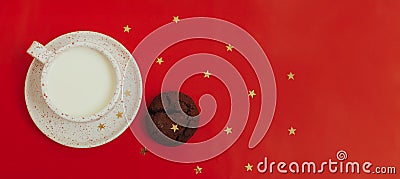 Cup with milk, cookies and gift on a green background. Minimalistic greeting banner. Christmas and New Year Stock Photo