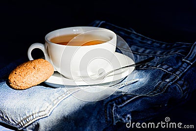 Cup mug hot tea and oat cookie. Mug filled tea close up. Herbal green or black whole leaf. Process tea brewing ceramic Stock Photo