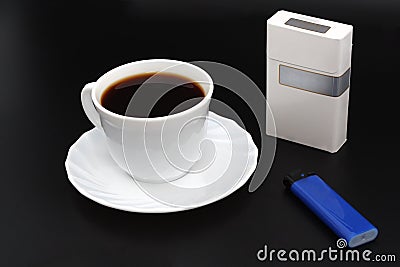 Cup os coffee. Cigarettes and lighter. Stock Photo