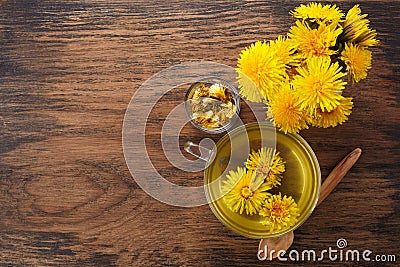 Cup ph healthy dandelion tea on vintage wooden background. Fresh herbs. Stock Photo
