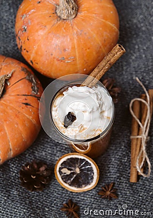 1 Cup pumpkin seeds juice with whipped cream and cinnamon, fresh whole pumpkin , slice susanoh of apelsina , top view Stock Photo