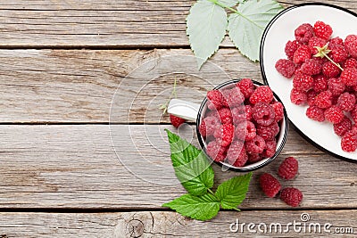 Cup of ripe raspberries Stock Photo