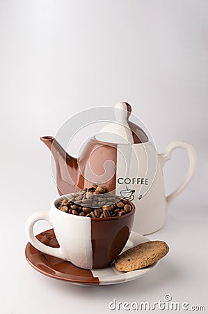 Cup of roasted brown coffee beans Stock Photo