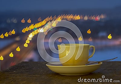 Cup and saucer with blurred colorful background Stock Photo
