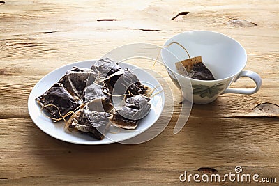 Cup and Saucer with Teabags Stock Photo