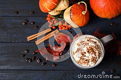 Cup with tasty pumpkin spice latte on blue wooden table Stock Photo