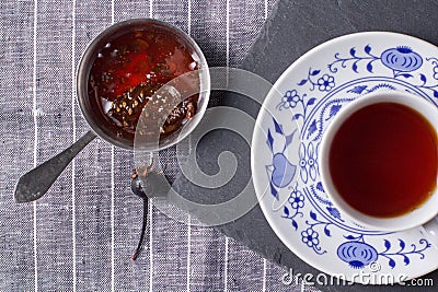 A cup of tea and cedar cone jam Stock Photo