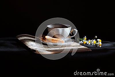 Cup of tea with daisies Stock Photo