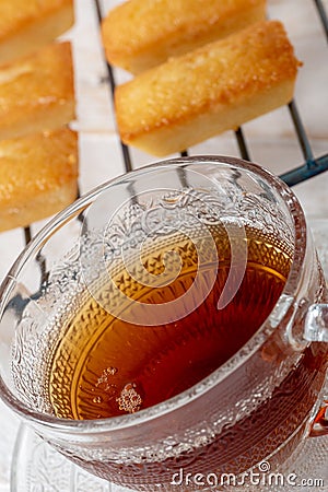 Cup of tea with homemade financier cake Stock Photo