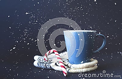 Cup of tea on knitted mittens. Christmas background. Hyugge style. Close-up Stock Photo