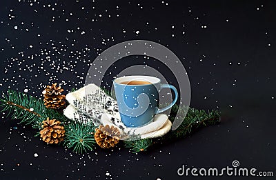 Cup of tea on knitted mittens. Christmas background. Hyugge style. Stock Photo