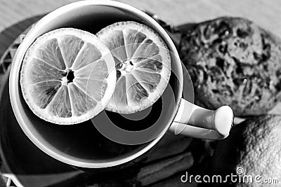 A cup of tea with lemon pieces - black and white. Stock Photo