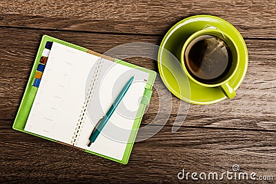 Cup of tea, pen, opened organizer Stock Photo