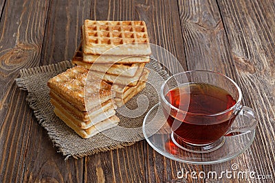 Cup of tea and stack of waffles and cookies Stock Photo