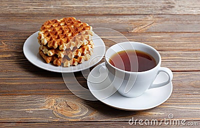 Cup of tea and stack of waffles Stock Photo