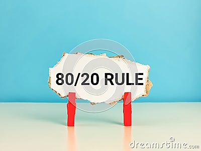 Cupboard strip written 80/20 rule on the table. Stock Photo